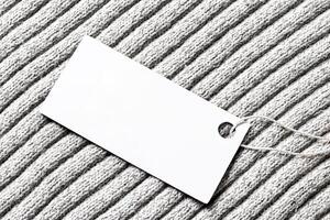 White label on a woolen fabric. Abstract background for design. Art stylized baner or mock up with copy space. photo
