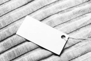 White label on a woolen fabric. Abstract background for design. Art stylized baner or mock up with copy space. photo