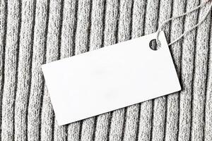 White label on a woolen fabric. Abstract background for design. Art stylized baner or mock up with copy space. photo