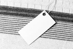 White label on a woolen fabric. Abstract background for design. Art stylized baner or mock up with copy space. photo