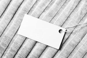 White label on a woolen fabric. Abstract background for design. Art stylized baner or mock up with copy space. photo