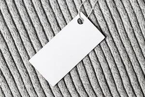 White label on a woolen fabric. Abstract background for design. Art stylized baner or mock up with copy space. photo