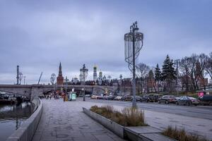 Traffic jam on a Moscow river embankment,Moscow Kremlin and Red Square. photo