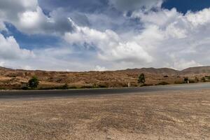 Road at Sahara desert in the afternoon. photo