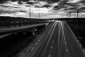 Moving car with blur light through twilight city. photo