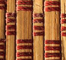 Texture of old bamboo branches with threads. photo