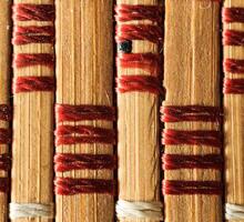 Texture of old bamboo branches with threads. photo