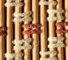 Texture of old bamboo branches with threads. photo