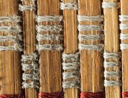 Texture of old bamboo branches with threads. photo