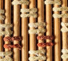 Texture of old bamboo branches with threads. photo