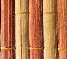Texture of old bamboo branches with threads. photo