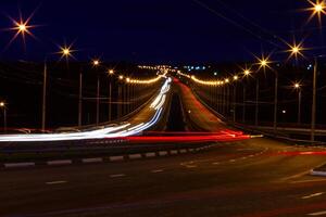 moving car with blur light through city photo