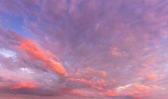Overcast twilight sky with purple clouds. Abstract background for design. photo