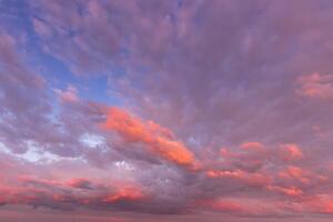Overcast twilight sky with purple clouds. Abstract background for design. photo