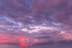 Overcast twilight sky with purple clouds. Abstract background for design. photo
