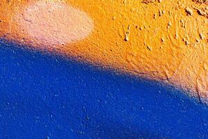 Fragment of colored graffiti painted on a wall. Abstract background for design. photo