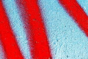 Fragment of colored graffiti painted on a wall. Abstract background for design. photo