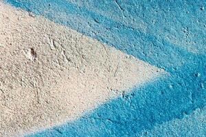 Fragment of colored graffiti painted on a wall. Abstract background for design. photo