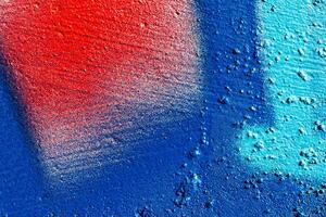 Fragment of colored graffiti painted on a wall. Abstract background for design. photo