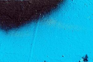 Fragment of colored graffiti painted on a wall. Abstract background for design. photo