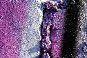 Fragment of colored graffiti painted on a wall. Abstract background for design. photo