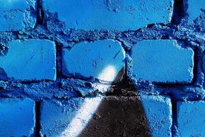Fragment of colored graffiti painted on a brick wall. Abstract background for design. photo