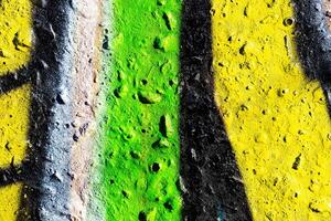 Fragment of colored graffiti painted on a concrete wall. Abstract background for design. photo