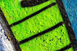 Fragment of colored graffiti painted on a concrete wall. Abstract background for design. photo