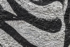 Graffiti painted on a concrete wall texture. photo