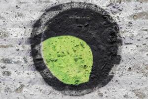 Graffiti painted on a concrete wall texture. photo