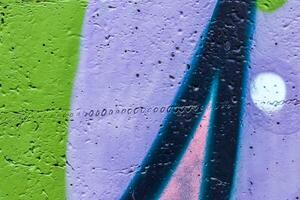 Graffiti painted on a concrete wall texture. photo