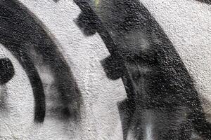 Graffiti painted on a concrete wall texture. photo