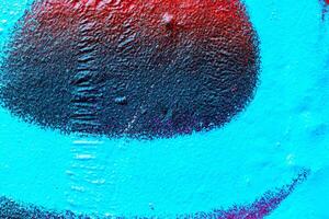 Fragment of colored graffiti painted on a wall. Bright abstract background. photo