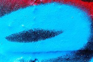 Fragment of colored graffiti painted on a wall. Bright abstract background. photo