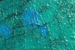 Fragment of colored graffiti painted on a wall. Bright abstract background. photo
