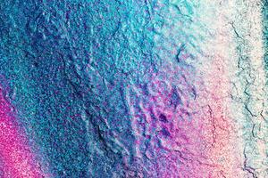 Fragment of colored graffiti painted on a wall. Bright abstract background. photo
