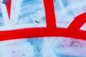 Fragment of colored graffiti painted on a wall. Bright abstract background. photo