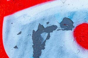 Fragment of colored graffiti painted on a wall. Bright abstract background. photo