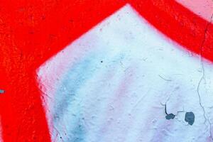 Fragment of colored graffiti painted on a wall. Bright abstract background. photo