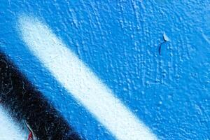 Fragment of colored graffiti painted on a wall. Bright abstract background. photo