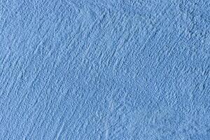 Texture of blue decorative plaster or stucco or concrete. Abstract background for design. photo