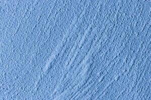 Texture of blue decorative plaster or stucco or concrete. Abstract background for design. photo