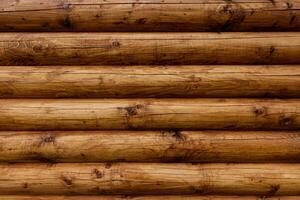 Wooden wall from logs as a background. photo