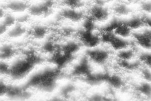 Snow texture at sunny winter day. Abstract background. photo