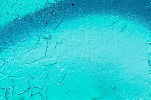 Fragment of colored graffiti painted on a stone wall. Old peeling paint. photo