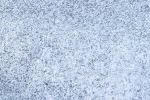 Texture of ice in the winter. Abstract background for design, photographed closeup. photo