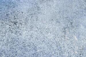 Texture of ice in the winter. Abstract background for design, photographed closeup. photo