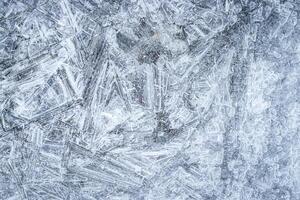 Texture of ice in the winter. Abstract background for design, photographed closeup. photo
