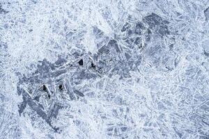 Texture of ice in the winter. Abstract background for design, photographed closeup. photo