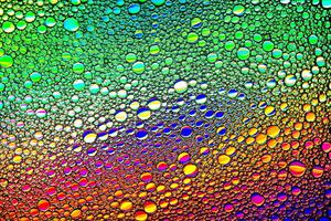 Colorful drops of oil on the water. Circles and ovals. Abstract bright backdrop for design. photo